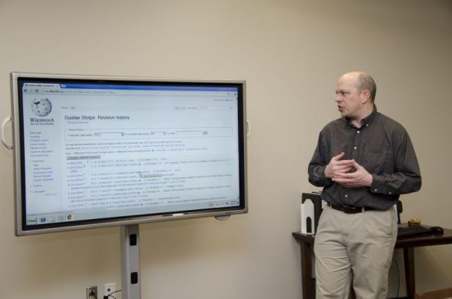 Shawn Beattie using Special Collections display for Wikipedia edit-a-thon.