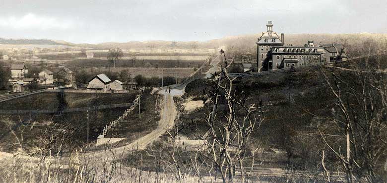 1880s view of 7th Avenue and the First College Building, Rock Island.