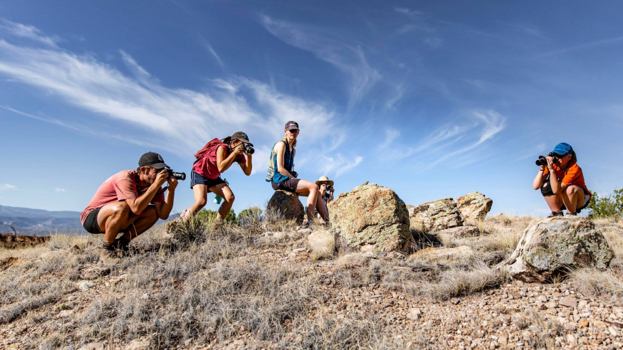 Students take landscape photos at Ghost Ranch in New Mexico.