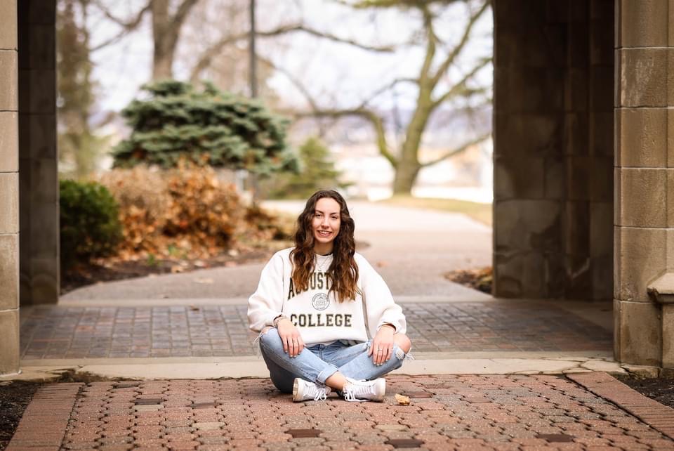 Augie daughter under the arches of Founders Hall