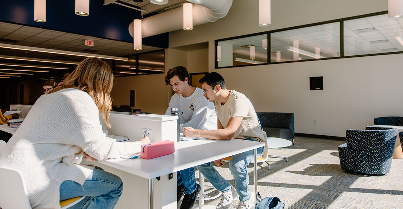 Three Student Studying at a table