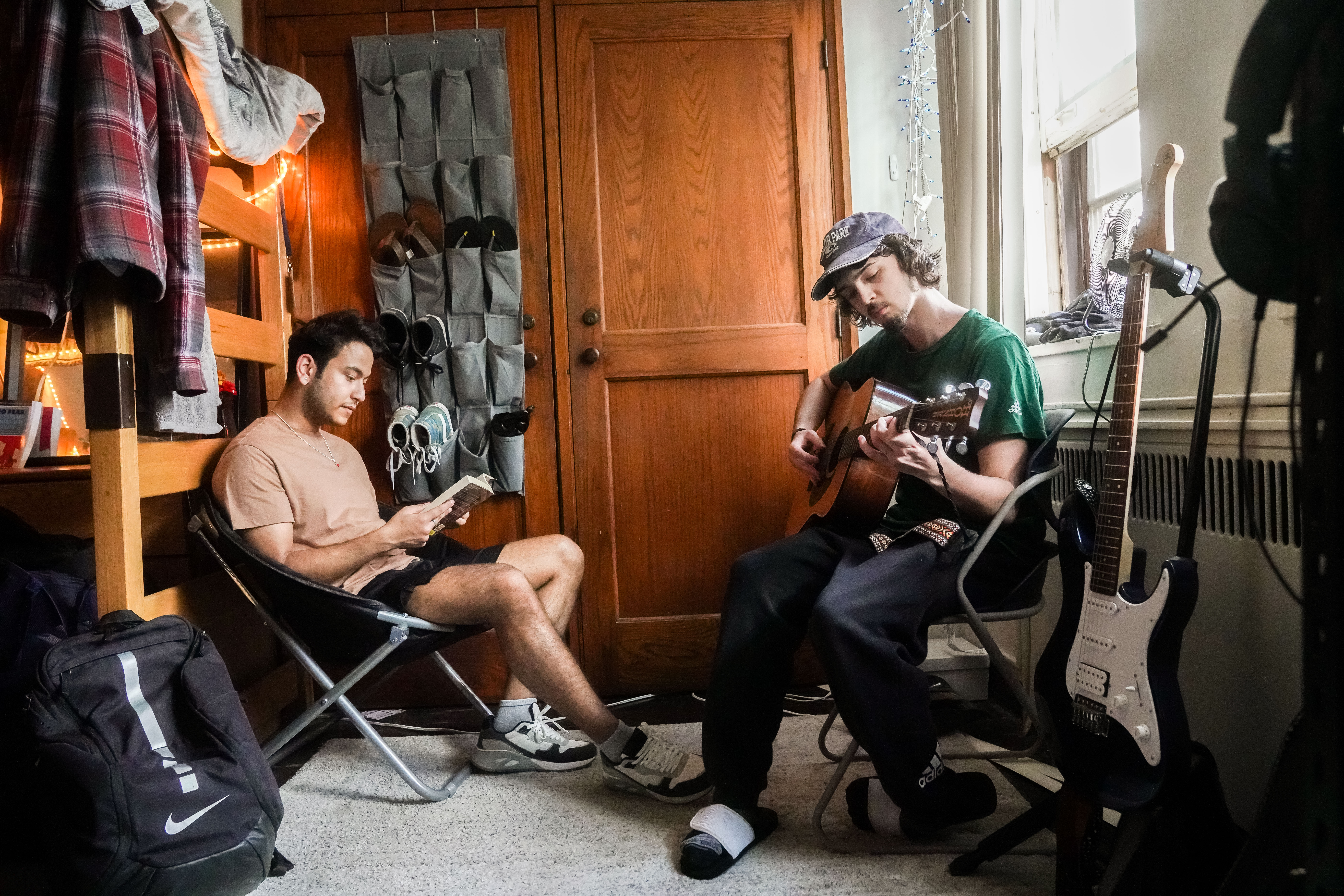 Two students sitting in a dorm room