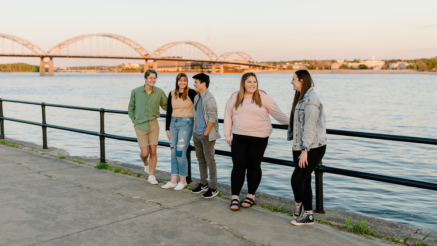 Students on the water front in front of the Centennial Bridge