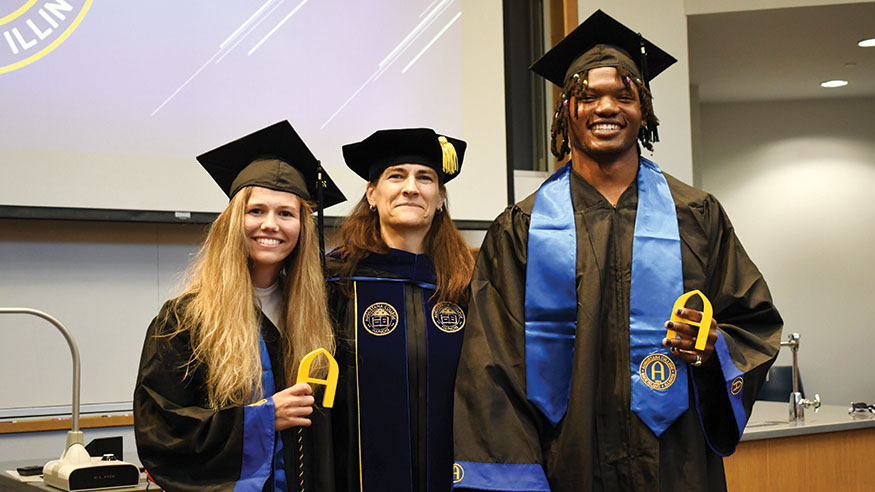 Emma Odle '24, President Andrea Talentino and Aykeem Spivey '24