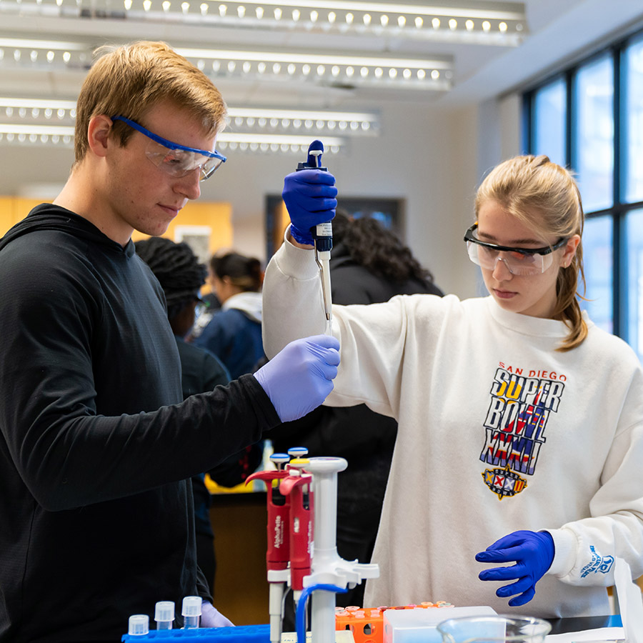 Two students in a science lab