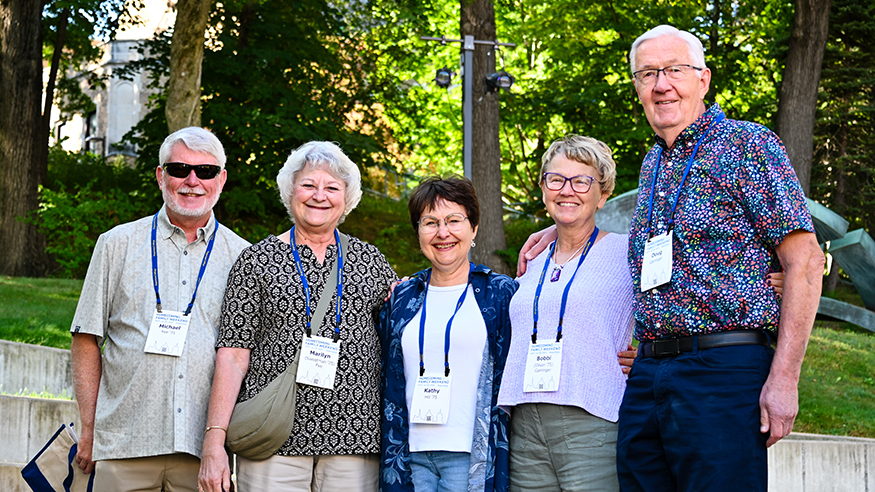 Alumni pose outside Brunner Theatre Center