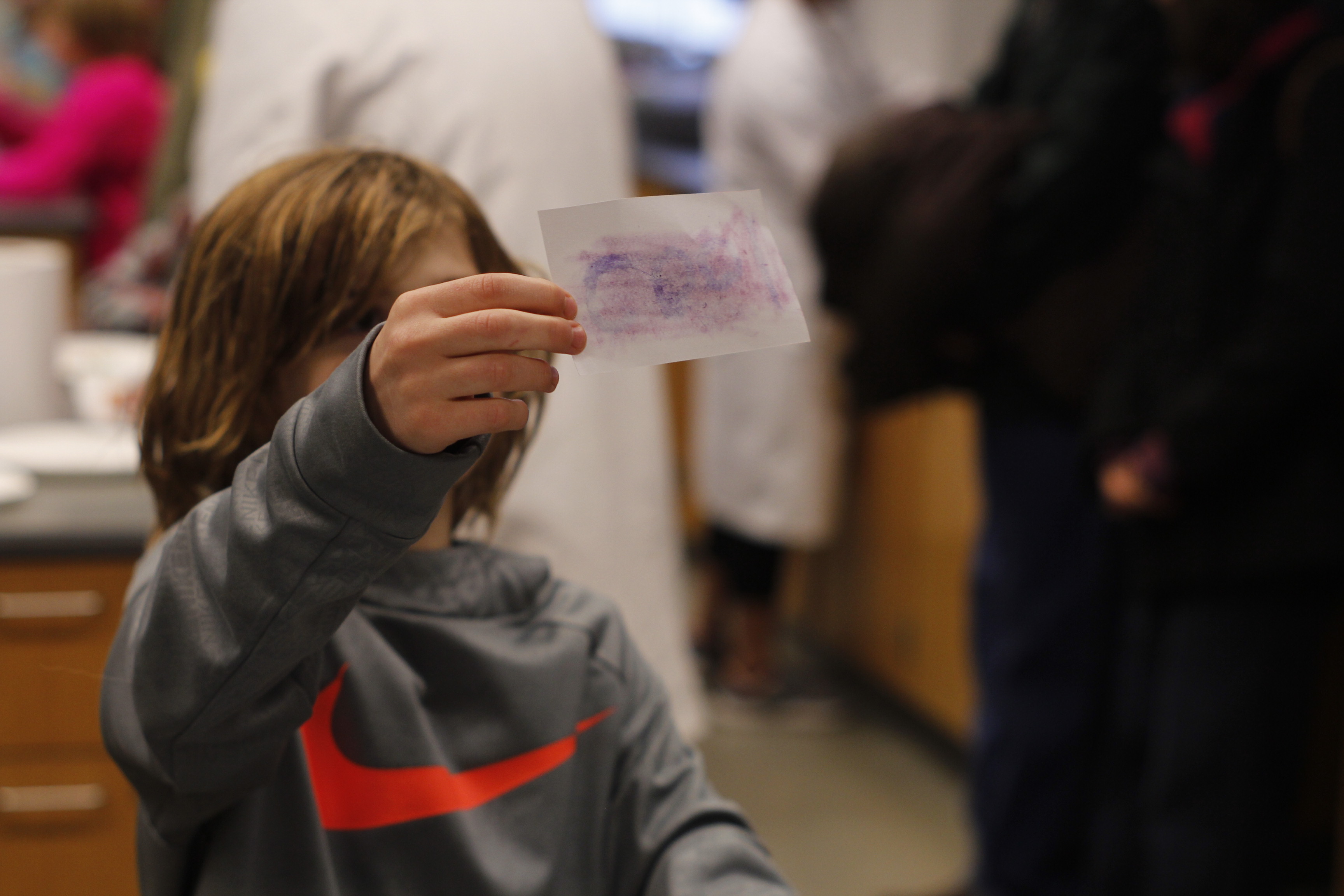 child holding paper