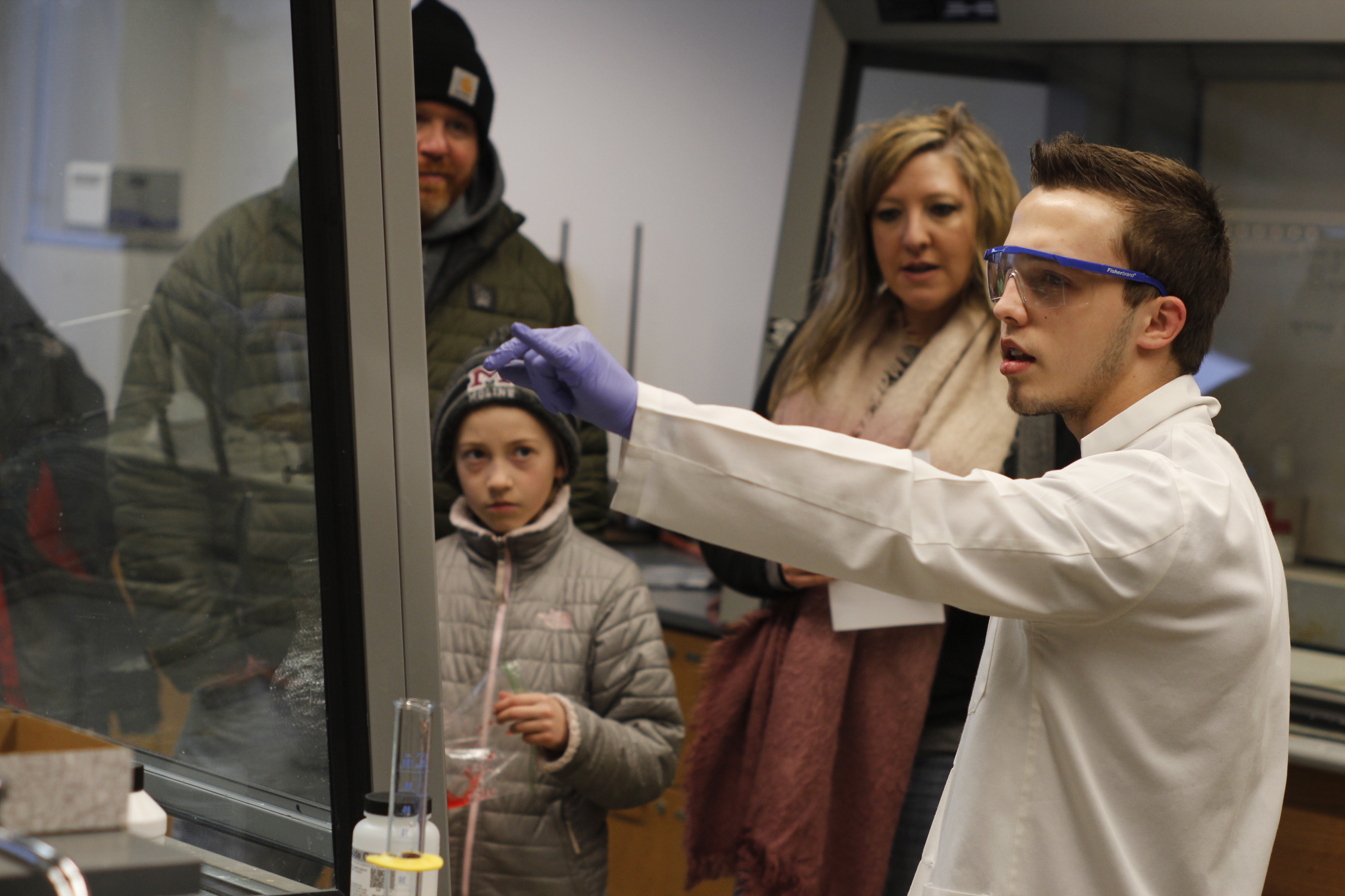 chemistry student doing demonstration