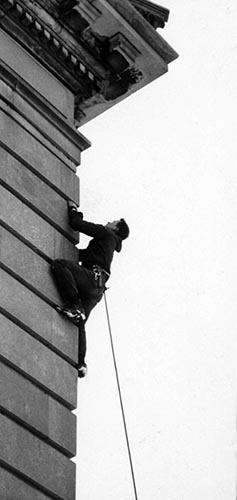 Roald Fryxell climbing Old Main, date unknown