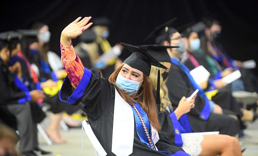 Waving student