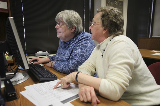 Volunteers work on genealogy