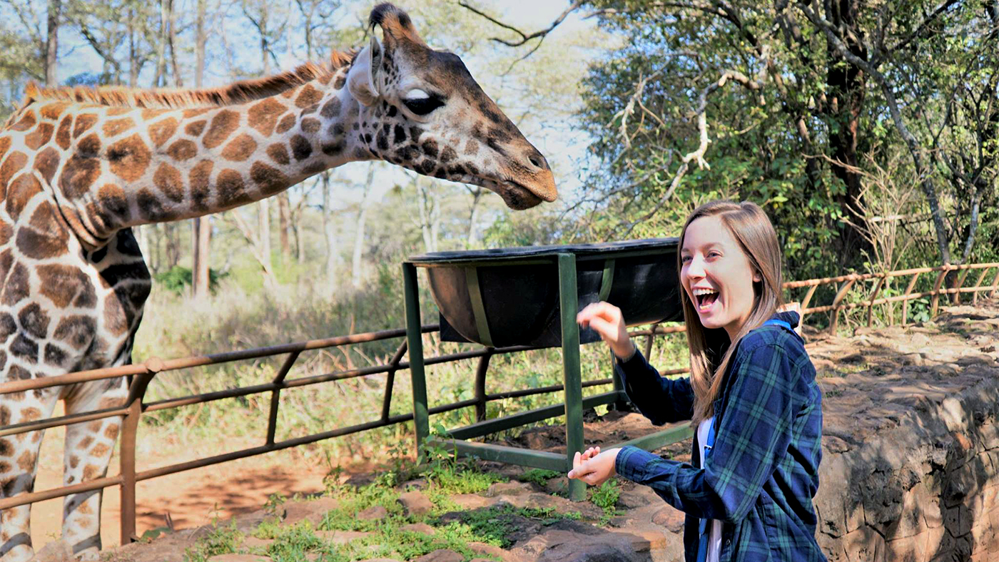 Brenna Whisler and giraffe