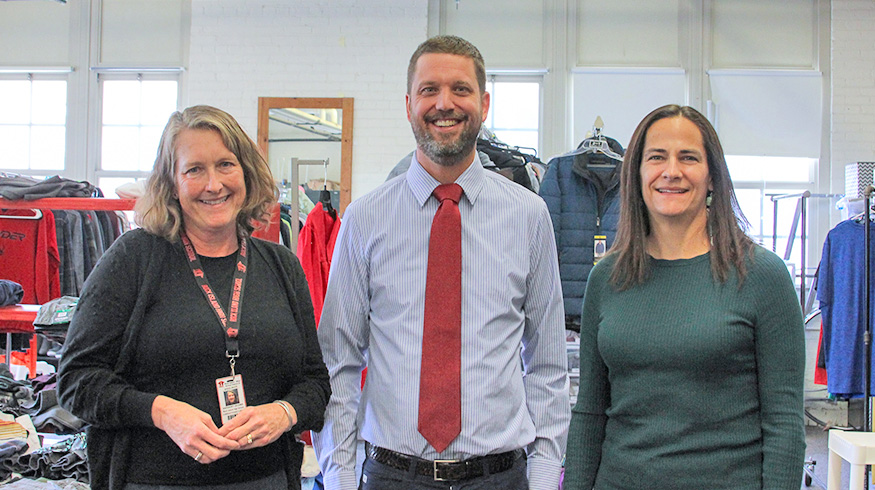 Rocky Resource Room coordinator Kathy Lelonek, Rock Island High School principal Jeff Whitaker and Augustana President Andrea Talentino at the check presentation on Oct. 31.