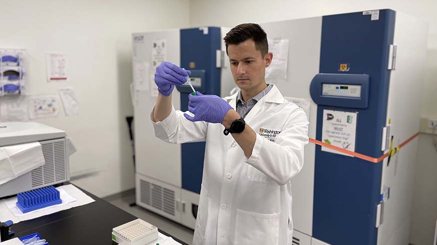 Max Petersen '10 working in the lab at Washington University