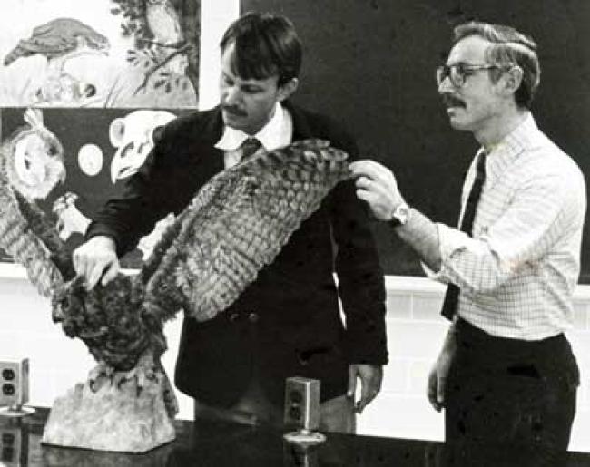 Ralph Troll, right, and Levi Wood use a stuffed owl in the classroom.