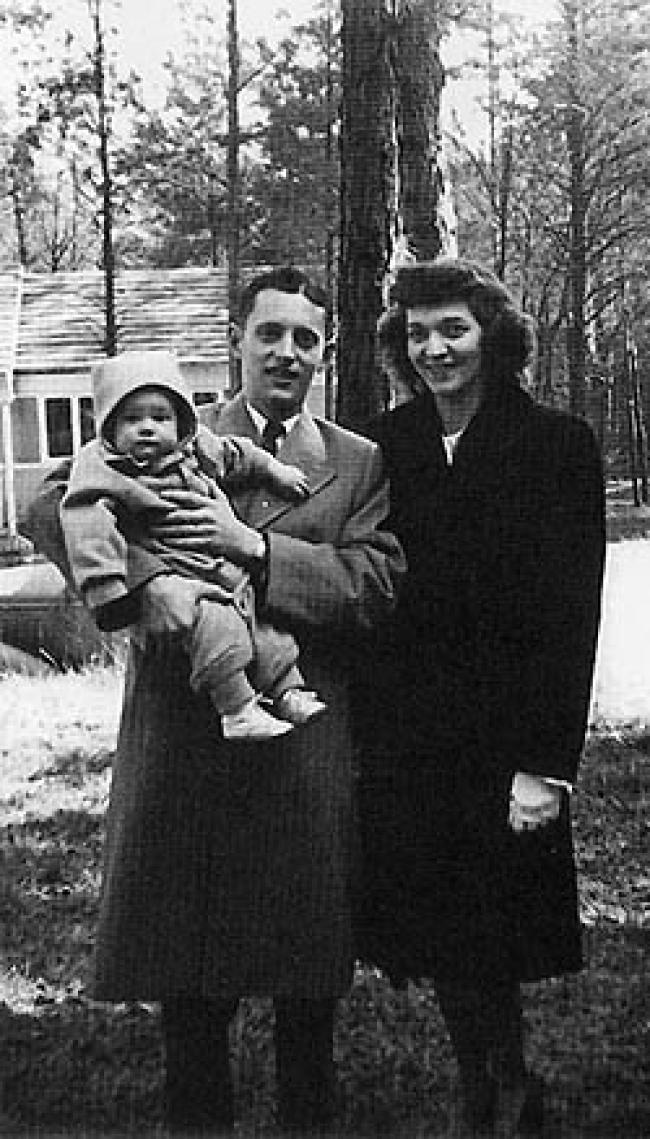 Clair Schersten '39 and Marion Mirfield '43 Schersten with Carol '68, then 8 months old, in the front yard of their Oak Ridge home. This photo was taken in February 1947.