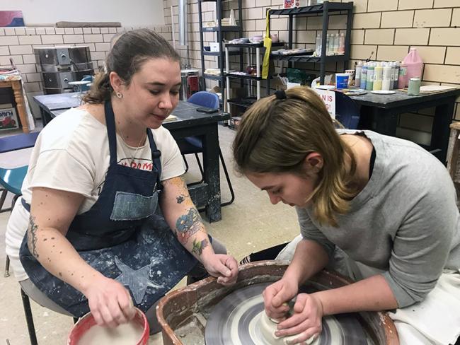Carolyn teaching a pottery lesson 