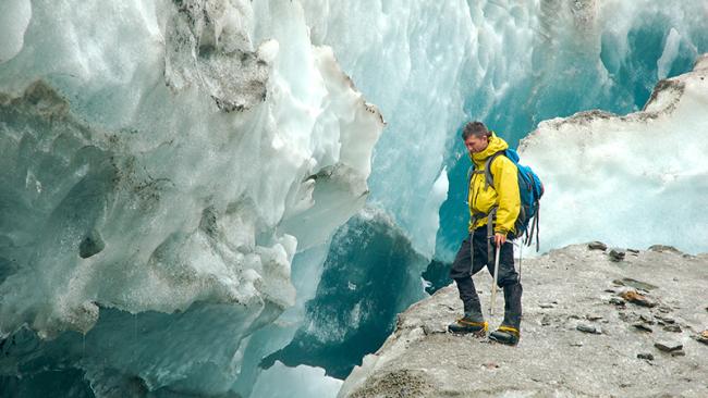 student at the edge of ice cliff