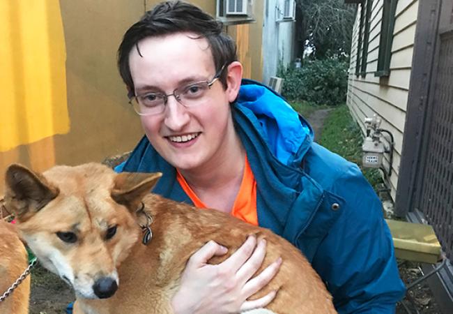 Ryan Johnson didn’t spend all of his time with marine animals. Here he holds an Australian dingo. 