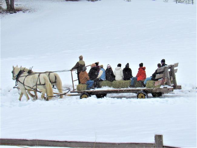 Montana J- Term Students enjoying a hayrack ride in the snow
