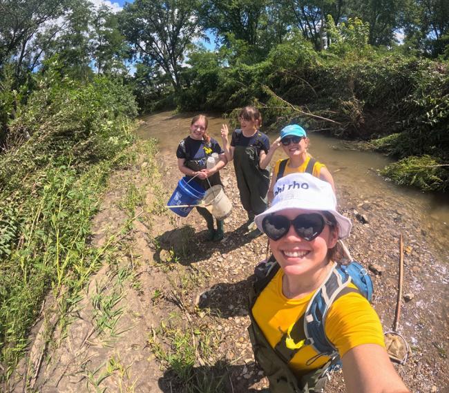 Four students on a trail