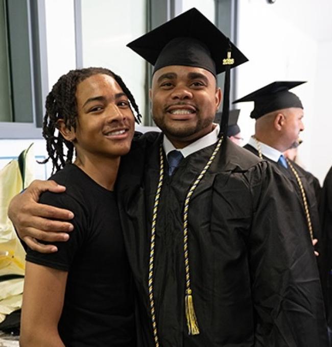 Grad with young boy
