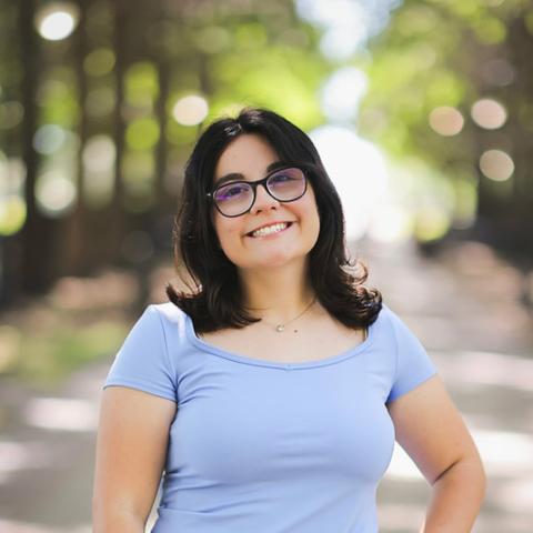 A women posing for a headshot.