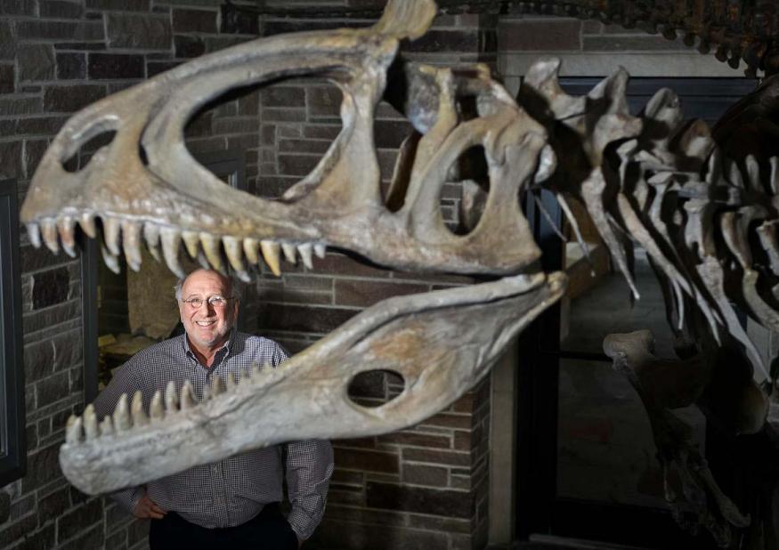 dinosaur with hammer on head
